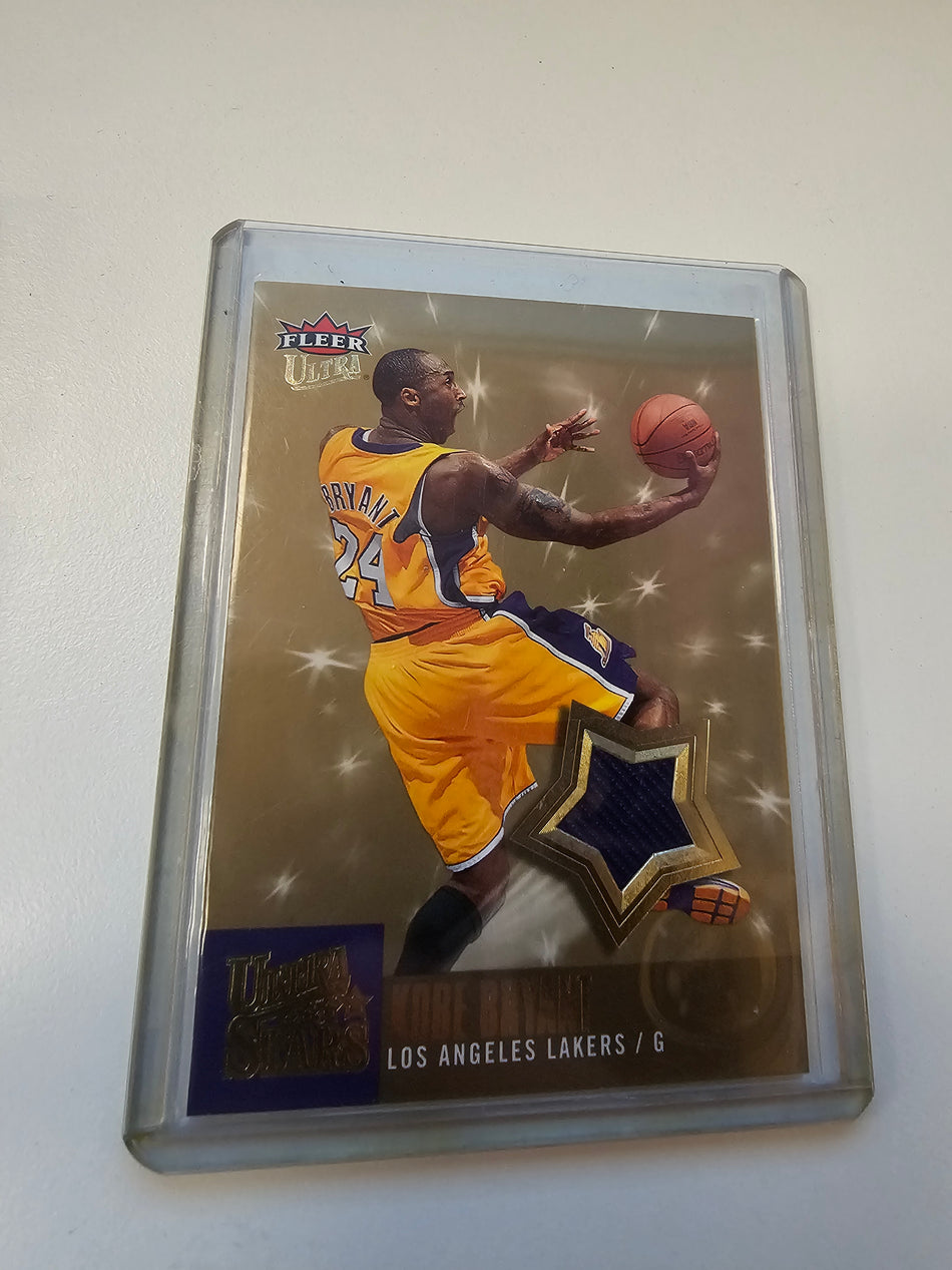 2007-08 Kobe Bryant Fleer Ultra Stars US-3 Game Worn Purple Los Angeles Lakers